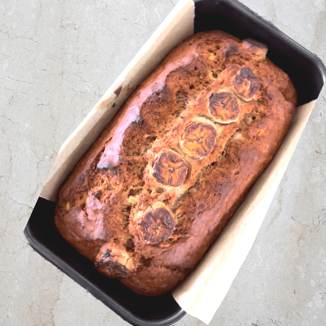 Homemade banana bread loaf with banana slices